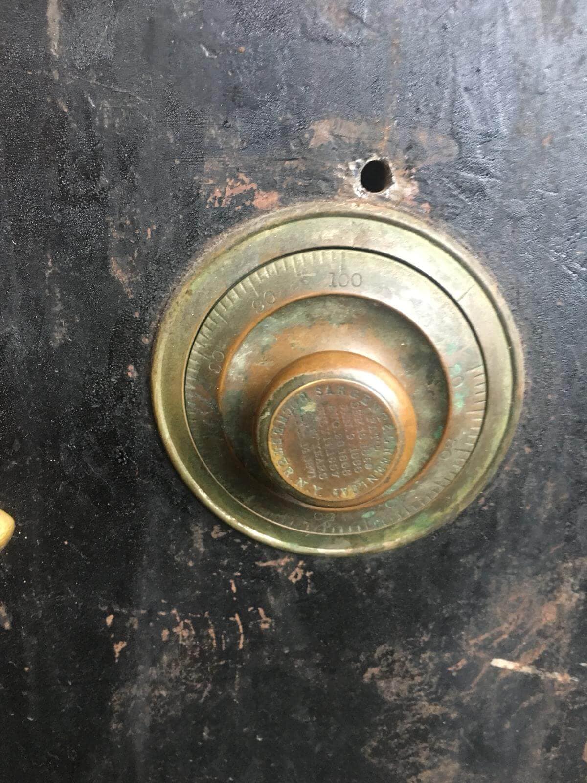 close up of drilled hole in safe