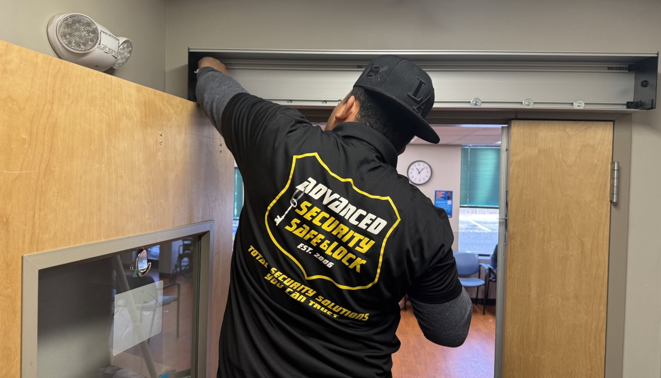 tech installing door opener for access control